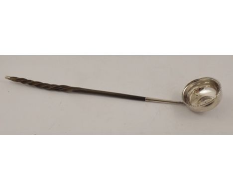 AN 18TH CENTURY TODDY LADLE with whalebone handle, inset Queen Anne coin 1709, 35cm long 