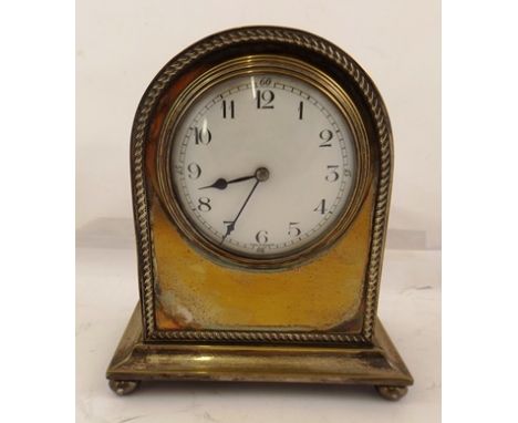 AN EARLY 20TH CENTURY FRENCH SILVER PLATED MANTEL CLOCK, of arched form, the case with gadrooned outline decoration, having w