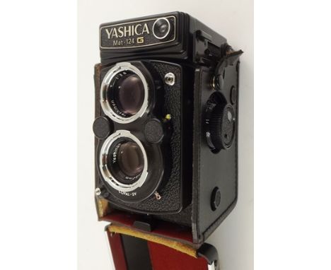 A YASHICA MAT-124 TWIN LENS RELEX CAMERA with lens cap and black leather case 