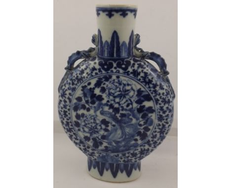 A CHINESE BLUE AND WHITE MOON FLASK of typical form and decoration having twin dragon handles, 26cm tall, unmarked 