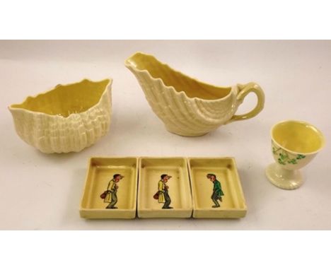 A BELLEEK GLAZED PARIAN SAUCE BOAT of moulded scallop form with coral handle, green factory backstamp, together with a BELLEE