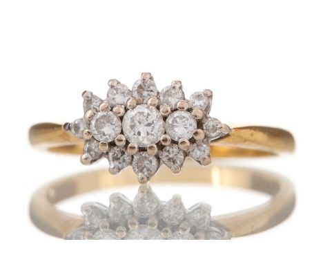 DIAMOND CLUSTER RING set with round brilliant cut diamonds totalling approximately 0.30 carats, in eighteen carat gold, size 