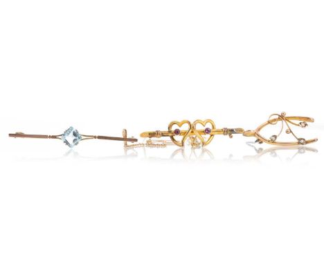 EARLY 20TH CENTURY BAR BROOCH modelled with two hearts each with a central purple stone, along with an aquamarine bar brooch,