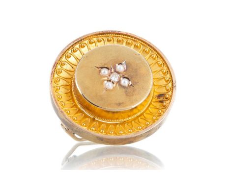 VICTORIAN DIAMOND AND SEED PEARL MOURNING BROOCH of circular form with central old cut diamond and seed pearl motif to the ce