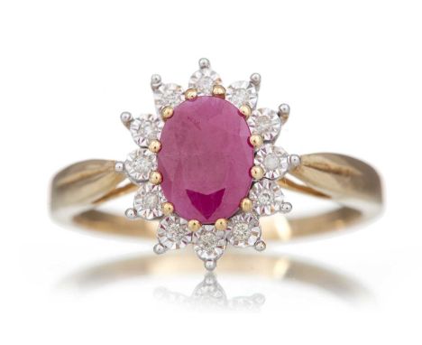 TREATED RUBY AND DIAMOND RING set with an oval treated ruby of approximately 0.92 carats within a halo of illusion set diamon