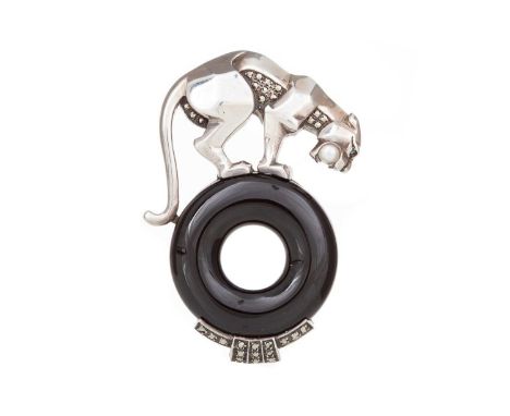 ONYX AND MARCASITE PANTHER BROOCH featuring the panther clutching a pearl between its jaws atop a section of onyx, in silverG