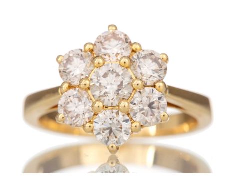 DIAMOND DAISY CLUSTER RING set with round brilliant cut diamonds totalling approximately 2.17 carats, in eighteen carat gold,