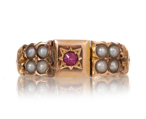 VICTORIAN RUBY AND PEARL RING LATE 19TH CENTURY set with a round ruby flanked by seed pearls, in fifteen carat gold, size M 1