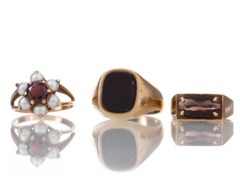 THREE GOLD RINGS comprising onyx signet ring, smoky quartz ring and garnet and seed pearl cluster, each in nine carat gold, 1