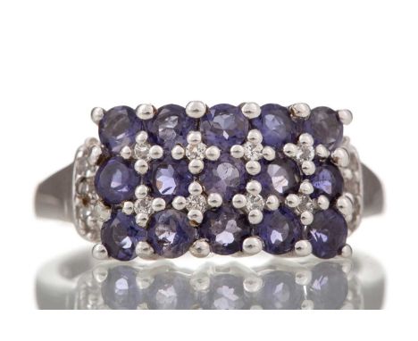 TANZANITE THREE ROW RING on diamond shoulders, in silver, size RGenerally worn.&nbsp;All stones intact and in fair condition.