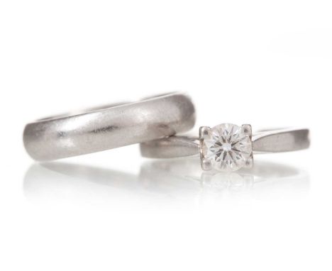 DIAMOND SOLITAIRE RING ALONG WITH A WEDDING BAND set with a round brilliant cut diamond of approximately 0.40 carats, along w