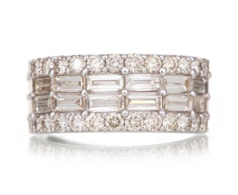 DIAMOND BAND set with round and baguette cut diamonds totalling approximately 2.72 carats, in nine carat white gold, size M