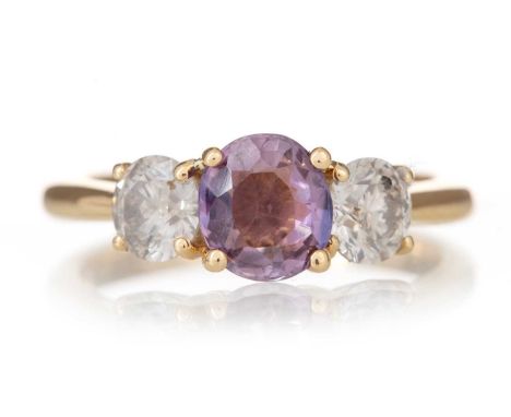 FANCY SAPPHIRE AND DIAMOND RING CERTIFICATED set with a natural fancy purple sapphire of approximately 1.41 carats, flanked b