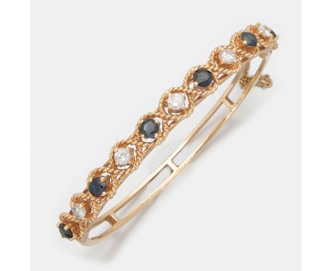 Gelbgold, gest. 14 ct.; Linear besetzt mit Brillanten von zus. ca. 1,00 ct. im Wechsel mit Saphiren von zus. ca. 1,20 ct., um