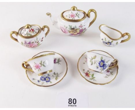 A Hammersley miniature tea service comprising: teapot, milk, sugar and two cups and saucers