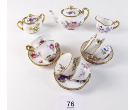 A Hammersley group of various miniature tea ware comprising: teapot, six cups and saucers, milk jug and sugar