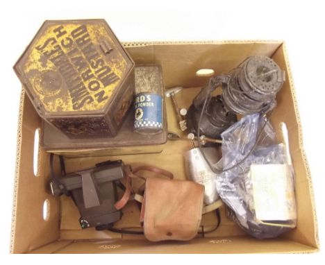 A hurricane lamp, two cameras, Church's shoe trees and three tins
