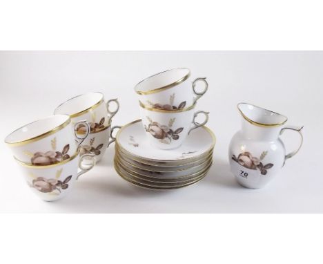 A Royal Copenhagen coffee set, comprising six cups and saucers and a milk jug, decorated brown and gilt flowers