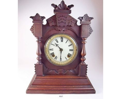 An Ansonia eight day Tivoli Striking mantel clock with pendulum and key, in carved case - 38cm
