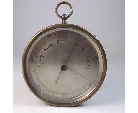 A brass cased circular marine barometer