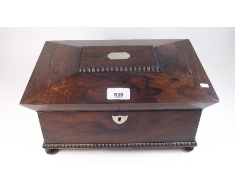 A 19th century rosewood tea caddy with mother of pearl and bone inlay, fitted two interior caddies