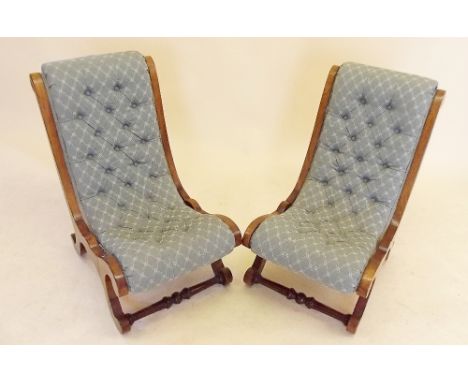 A pair of small Victorian walnut slope back nursing chairs, with button upholstery
