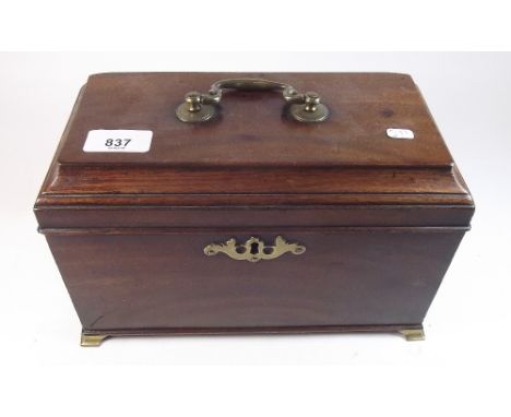 A Georgian mahogany tea caddy with brass mounts and fitted triple lidded caddies within