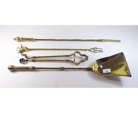 Four brass fireside tools including toasting fork with bulls head terminal