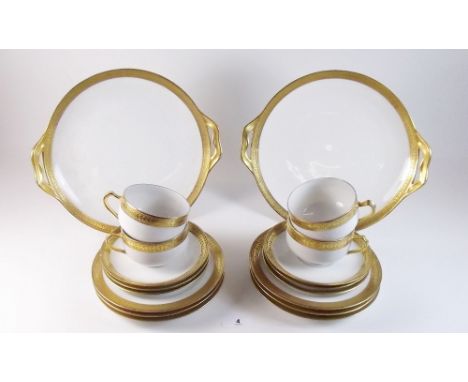 A Haviland Limoges tea service comprising: five gilt edged cups, six saucers, six teaplates and two cake plates