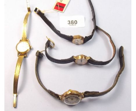 A Tissot 18 carat gold ladies wrist watch with plated strap, a Zenith 18 carat gold watch and two other ladies watches
