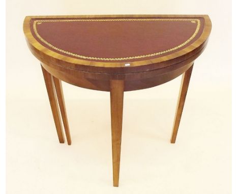 A fold top demi-lune console table fitted backgammon marquetry board to centre, on tapered supports