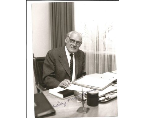 Willi Messerschmitt signed 7 x 5 b/w portrait photo sitting at his desk in later years. Probably Messerschmitt's single most 