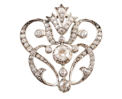 Circa 1900 diamond garland brooch , the Art Nouveau style open work design with central round old cut diamond weighing approx