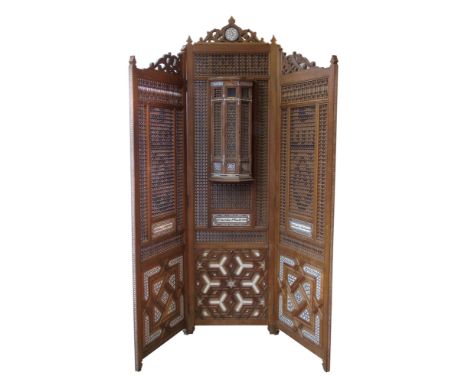 Three leaf hardwood screen, possibly Syrian with multiple turned panels, lower section with mother-of-pearl and ivory inlaid 