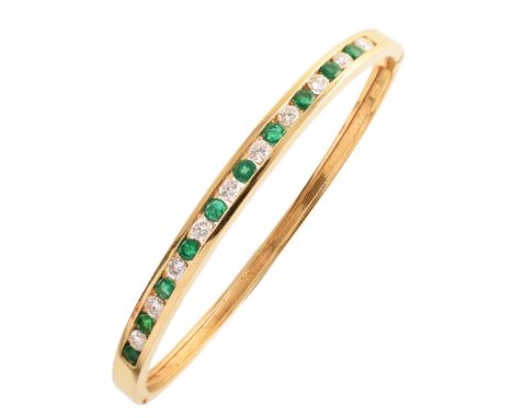 Diamond and emerald set 18ct yellow gold bangle , hinged yellow gold bangle channel set with 10 small round brilliant cut eme