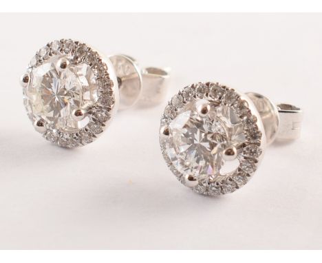 Pair of diamond 18ct white gold stud earrings , each earring comprising a round brilliant cut diamond weighing approx. 0.45 c