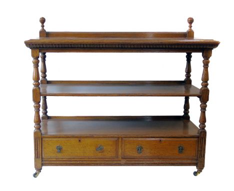 Edwardian light oak buffet, rectangular top above two stage shelf, supported on turned columns, box base containing two drawe