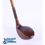 Large head left handed Brassie in dark stained persimmon stamped Ernest W le Fevre with attractively