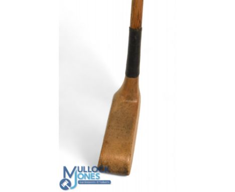 T Travers patent elongated rectangular wooden head putter in light stained persimmon with very dropped toe containing seven c