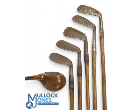 Selection of Hickory clubs (6) featuring a Tom Stewart wide soled niblick for J Hood, flange sol mashie for Taggart, Wilmslow