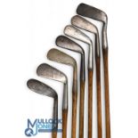 7x Assorted Tom Stewart irons features an R Walker mashie niblick, 2x mashies, a no 3 iron, a mid