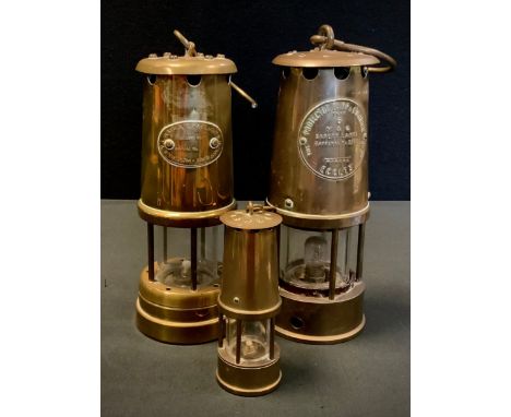 A brass Eccles safety lamp; others similar (3) 