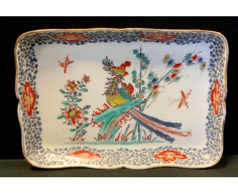 A 20th century Chinese trinket dish, decorated with a phoenix and a border of flowers and foliage, 20cmx28cm 