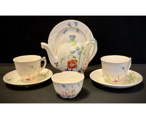 A Beswick duet tea set, relief decorated in the Wayside floral design, c.1920 inc 871 shape teapot, two cups and saucers, bre