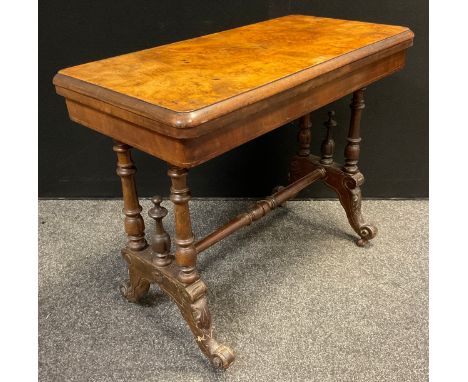 A Victorian walnut and burr walnut card table, rounded rectangular top, turned supports, ceramic casters, 70cm high, 88cm  wi