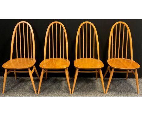 A set of four ‘Windsor’ design dining chairs, by Lucian Ercolani for Ercol, high hoop-backs, turned spindles, Elm seats, beec