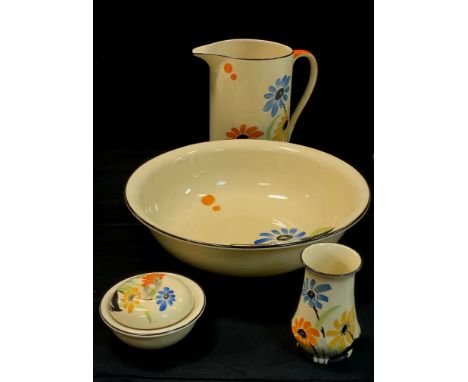 An Art Deco style Myott hand painted four piece Dressing table washing set, painted with spring flowers, yellow ground, c,193