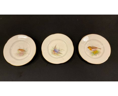 A pair of Royal Worcester quarter lobbed miniature cabinet plates, painted with a Swallow resting on a branch and Woodlark, 1