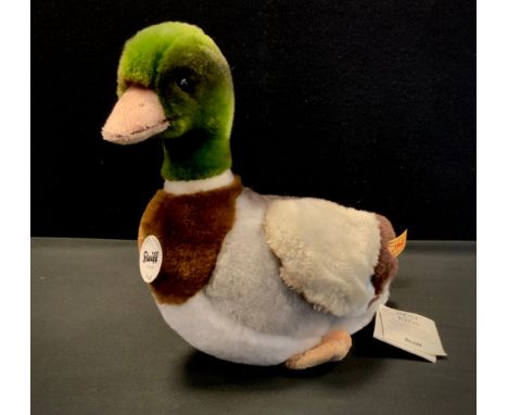 A Steiff soft toy, Waggi Duck, yellow tag and card. 