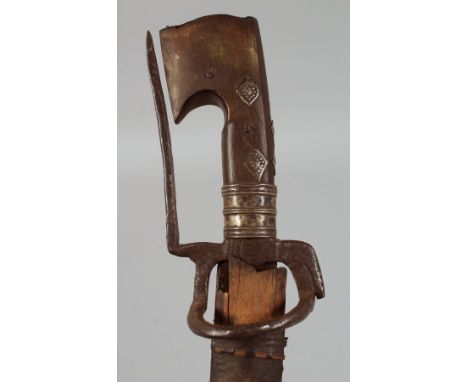AN ANTIQUE ETHIOPIAN RHINO HORN HILTED SWORD, with leather and wood scabbard, 101cm overall.&nbsp;**Please note:&nbsp; this i